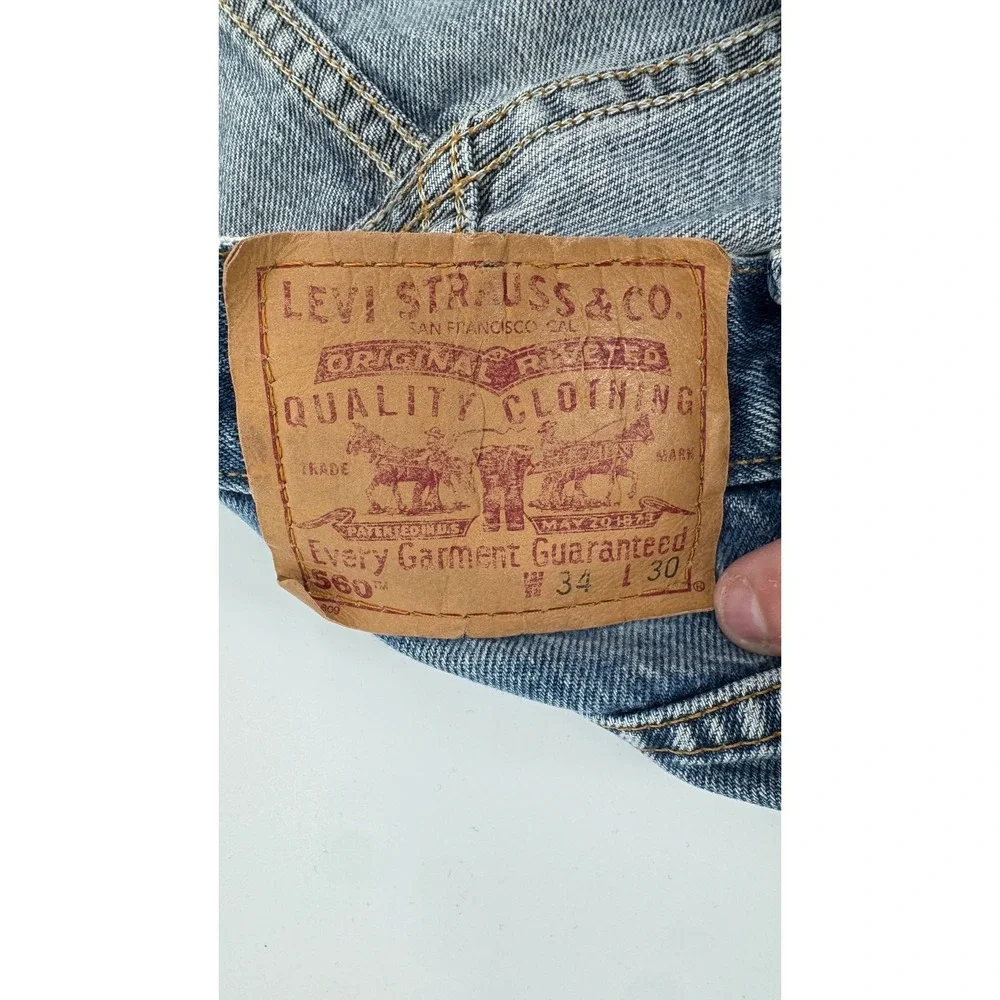 Vintage Levi's 560 Loose Fit Tapered Jeans Mens 34x30 Blue Made in USA 90s